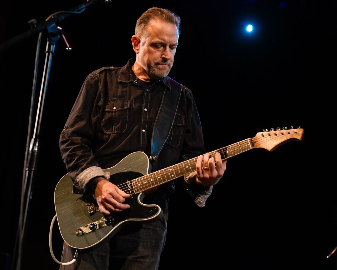 Brent Pruner performing on guitar