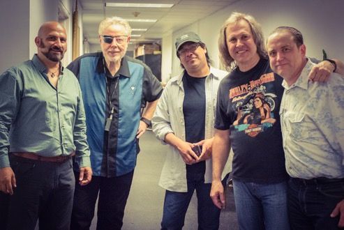 Brent Pruner backstage with the band Kansas